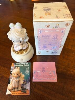 Precious Moments white and gold figurine with pastel accents